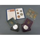 An uncirculated 1953 coronation set of UK coins together with two Festival of Britain crowns (green