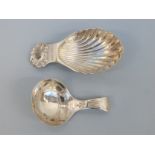 A hallmarked caddy spoon of shell form, Birmingham maker A Maston & Co, together with another,