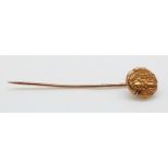 A yellow metal stick pin set with a Greek coin, 5cm,