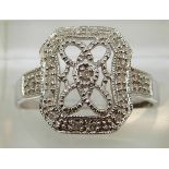 A 9ct white gold ring set with diamonds in a rectangular cluster, 2.