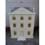 A large fully furnished Georgian style dolls house with removable roof,