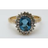 A 9ct gold ring set with a blue topaz surrounded by diamonds (size Q)