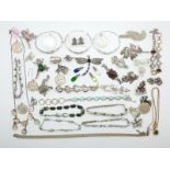 A collection of silver jewellery including a bracelet set with garnets, brooch set with garnets,