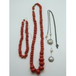 A coral necklace and matching bracelet together with a silver necklace set with pearls
