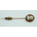 A Victorian stick pin set with an oval cameo and seed pearls to the rope twist border, length 7.