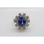 A platinum ring set with a cushion cut cornflower blue sapphire of approximately 5.