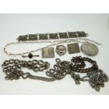 A collection of jewellery to include silver necklaces, silver bracelet, silver brooch,