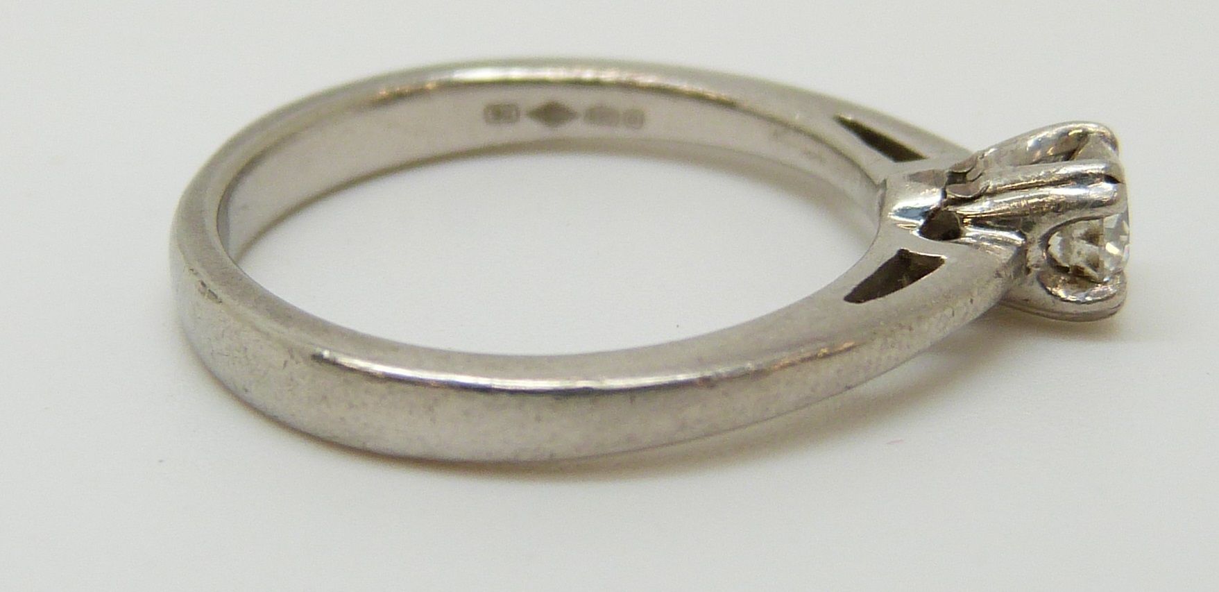 A platinum ring set with a diamond of approximately 0.28ct, 4. - Image 2 of 2