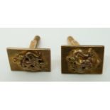 A pair of Chinese 9ct gold cufflinks with dragons to the front (9.