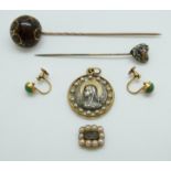 A pair of 9ct gold earrings set with a turquoise cabochon to each,