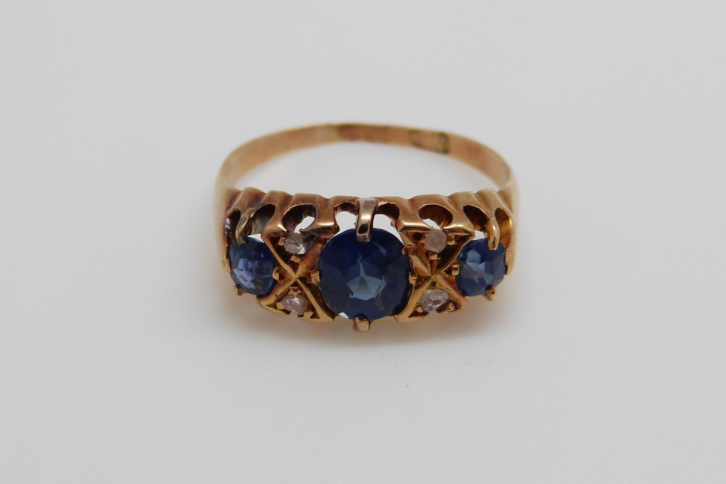 An 18ct gold ring set with three oval cut sapphires and four diamonds (size K/L) - Image 3 of 8