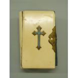 Ivory bound Book of Common Prayer with enamelled cross and brass clasp