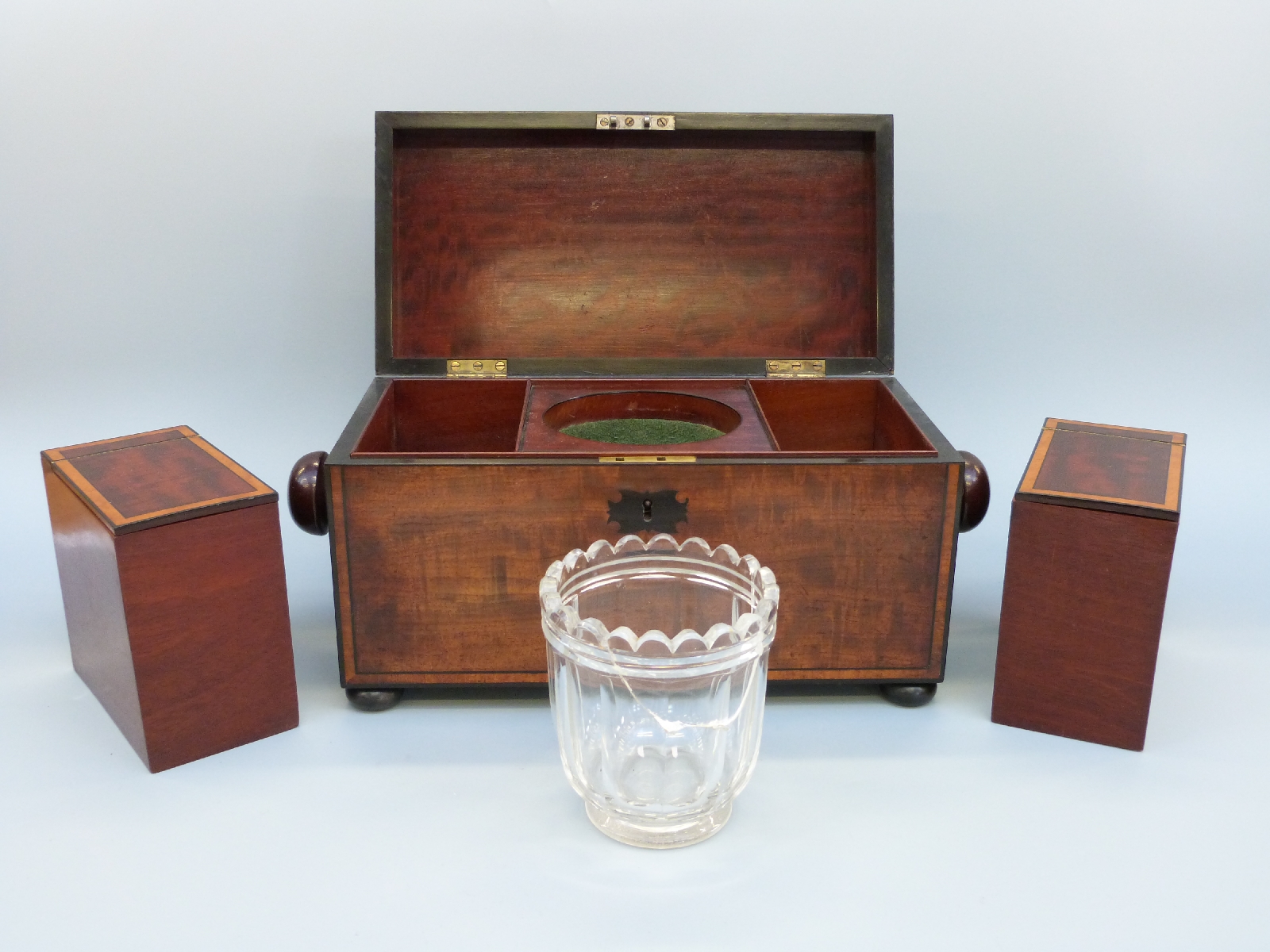 An early 19thC mahogany tea caddy of rectangular form with inlaid ebony detail, raised on bun feet, - Image 4 of 8