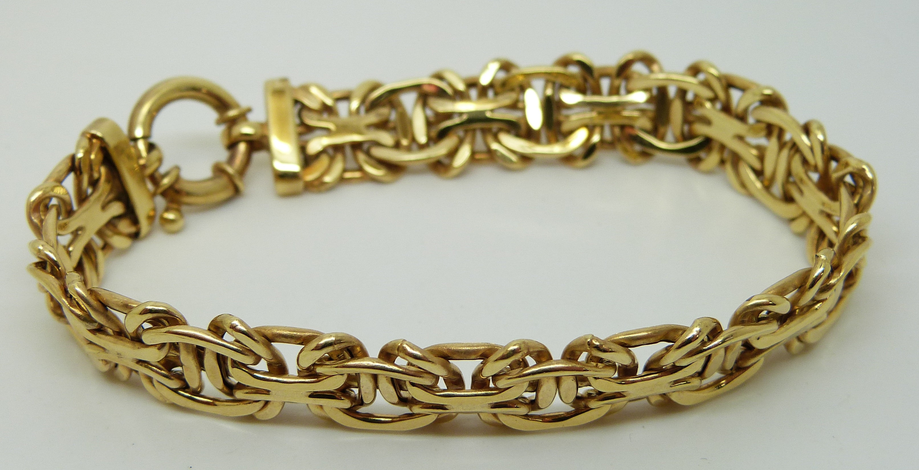 A 9ct gold bracelet in a plaited design, 9.