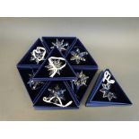 A collection of eight Swarovski Christmas tree ornaments comprising 2006 through to 2013,