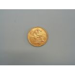 A 1909 gold half sovereign.