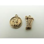 A 9ct gold charm in the form of a harp and a 9ct gold St Christopher, 3.