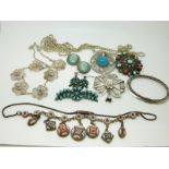 A silver rope twist chain, a silver filigree necklace, a silver filigree brooch,