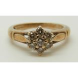 A 9ct gold ring set with diamonds in a cluster, total diamond weight approximately 0.33ct, 3.