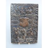 A Chinese white metal cigarette case embossed with figures, bamboo, trees and a bird,