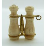 A bone Stanhope in the form of a pair of binoculars, 2.