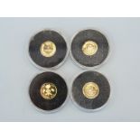 Four miniature gold coins comprising Andora 5 Diners,