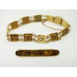 A yellow metal Egyptian bracelet and matching brooch, 19.