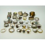 Thirty silver rings including examples set with abalone, garnet, amethysts, mother of pearl,