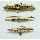 Three 9ct gold brooches including one set with an aquamarine,