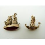 Two 9ct gold pendants/ charms in the form of boats,