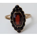 A 9ct gold Victorian ring set with a garnets (size K)