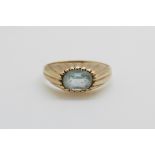 A 9ct gold ring set with an oval pale blue topaz (size I)