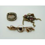 A 9ct gold brooch set with a garnet,