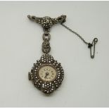 A silver cocktail watch/brooch set with marcasite