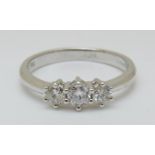 An 18ct white gold ring set with three diamonds, total diamond weight 0.