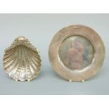 A hallmarked silver calling card tray, diameter 12cm and a shell shaped footed bonbon dish,