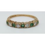 A 9ct gold ring set with emeralds and cubic zirconia (size K)