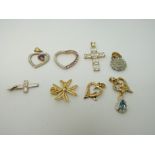 A collection of mainly 9ct gold pendants including diamond set, filigree, hearts, crosses etc., 12.