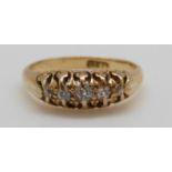 An 18ct gold ring set with five diamonds, 3.