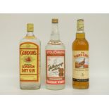 Three bottles of spirits comprising Famous Grouse whisky 70cl 40% vol, Gordon's gin 1 litre 47.