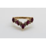 A 14ct gold ring set with diamonds and rubies in a V shape, 3.