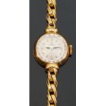 Omega 18ct gold ladies wristwatch with black hands, gold baton markers and multi-faceted bezel,
