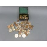 An amateur collection of UK and overseas coinage some in leather covered box,