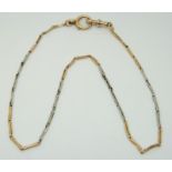 An 18ct bi-coloured gold watch chain made up of elongated links, 7.