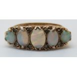 A 9ct gold ring set with five graduated opals (size O)
