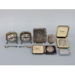 A hallmarked silver cigarette case, vesta, Goldsmith & Silversmith Company swimming medal,