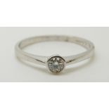 An 18ct white gold ring set with a diamond of approximately 0.2ct, 2.