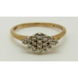 A 9ct gold ring set with diamonds in a cluster, 1.