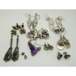 Six pairs of silver cat earrings,