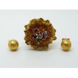 An 18ct gold earring in the form of a flower set with amethyst, citrine,